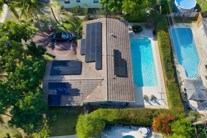 A Truly Unique and Special home that is hard to find.. Newer Roof, Large Pool. The X-Large In-Law Suite has Full Bath, Sitting area and even space for a Kitchenette..separate entrance adds lots of possibilities... This single family home is located on a quiet street with No HOA! Ample Parking for 5 Cars, Basketball Court in Driveway, 2 Car Garage, Very Clean and Nicely Renovated over the years, this comfortable 4 Bedroom / 4 Bathroom property is a Rare Find! Large Bedrooms with attached Baths, Galley style Kitchen has Wood Cabinets, Granite Countertops and Stainless Appliances...and the nice circular flow to this home provides everyone both plenty of privacy and spaces to be together. Large Private Fenced Pool for Entertaining or Relaxing. The Very Low Taxes for 2026 are a Huge Bonus too!