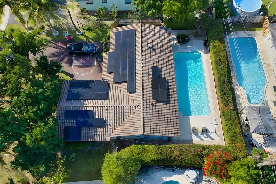 A Truly Unique and Special home that is hard to find.. Newer Roof, Large Pool. The X-Large In-Law Suite has Full Bath, Sitting area and even space for a Kitchenette..separate entrance adds lots of possibilities... This single family home is located on a quiet street with No HOA! Ample Parking for 5 Cars, Basketball Court in Driveway, 2 Car Garage, Very Clean and Nicely Renovated over the years, this comfortable 4 Bedroom / 4 Bathroom property is a Rare Find! Large Bedrooms with attached Baths, Galley style Kitchen has Wood Cabinets, Granite Countertops and Stainless Appliances...and the nice circular flow to this home provides everyone both plenty of privacy and spaces to be together. Large Private Fenced Pool for Entertaining or Relaxing. The Very Low Taxes for 2026 are a Huge Bonus too!