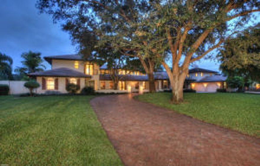 SPRAWLING 2 STORY FAMILY HOME ON A LUSH & PRIVATE 1 ACRE LOT STYLISHLY RENOVATED WITH CONTEMPORARY INFLUENCES AND QUALITY CUSTOM FINISHES OFFERING 11,344 TOTAL SQ. FT., 7 BR'S PLUS HIS & HER OFFICES, PLAYROOM, LARGE IN-LAW SUITE W/ FULL KITCHEN, IMPACT GLASS THROUGHOUT, VENETIAN PLASTER, MARBLE & WALNUT FLOORING, ''LUTRON'' LIGHTING SYSTEM, 3 LAUNDRIES, 6-CAR GARAGE, HUGE SCREENED ENTERTAINING AREA WITH SUMMER KITCHEN AND SPECTACULAR POOL AREA WITH WATERFALL, GROTTO, SLIDE & ZIP LINE FOR THE KIDS!!