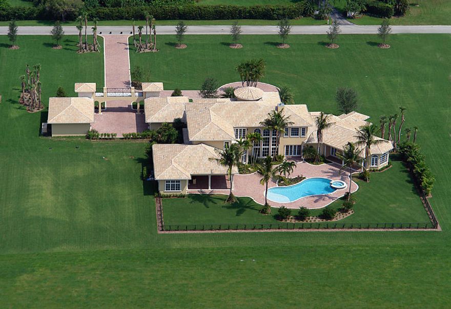 With 8,879 +/- air conditioned square feet and 13,510 +/- total square feet this estate boasts 7 bedrooms, 8 1/2 baths plus media, exercise, library and playroom.  6-bay garage, marble and granite throughout.  Large pool and patio.  2nd floor is made of concrete.  Information herein deemed reliable but subject to change without notice.