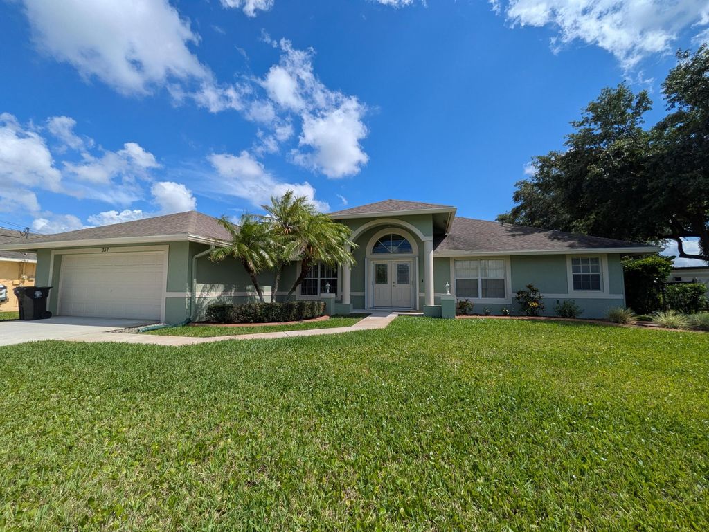 Photo of 357 SE Cork Road, Port Saint Lucie, FL 34984 (MLS # B26034217)