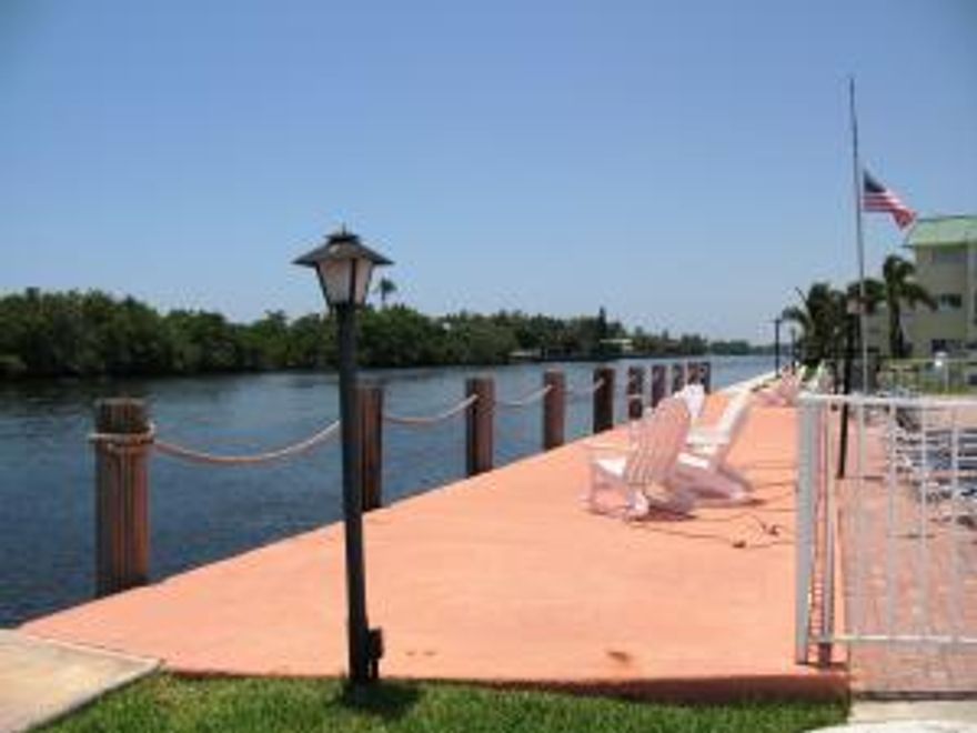 Lovely ground floor unit beautifully maintained. Updated baths. Eat in kitchen. Hurricane Impact Windows. Walk out the door from the enclosed Lanai and you are a few steps from the Remodeled Clubhouse and Heated, Saltwater Pool that are on the Intracoastal. Resort-style living! Minutes to Oceanfront Park, Boynton's Beach. Close to Shopping and Restaurants and Trendy Downtown Delray Beach. Furniture is negotiable.