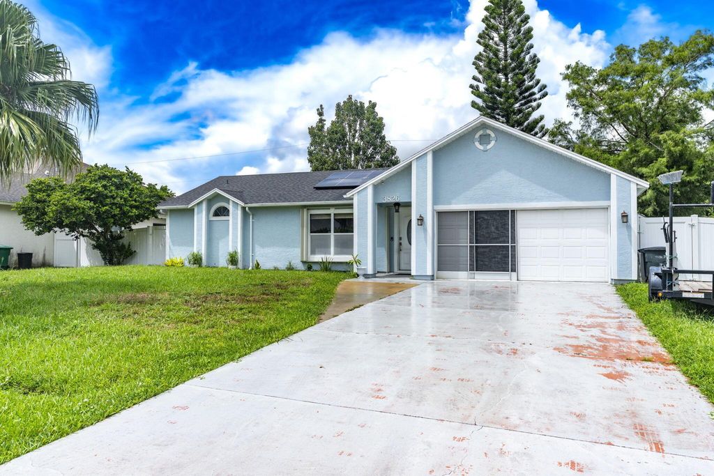 Photo of 3826 SW Kocerik Street, Port Saint Lucie, FL 34953 (MLS # R11122035)