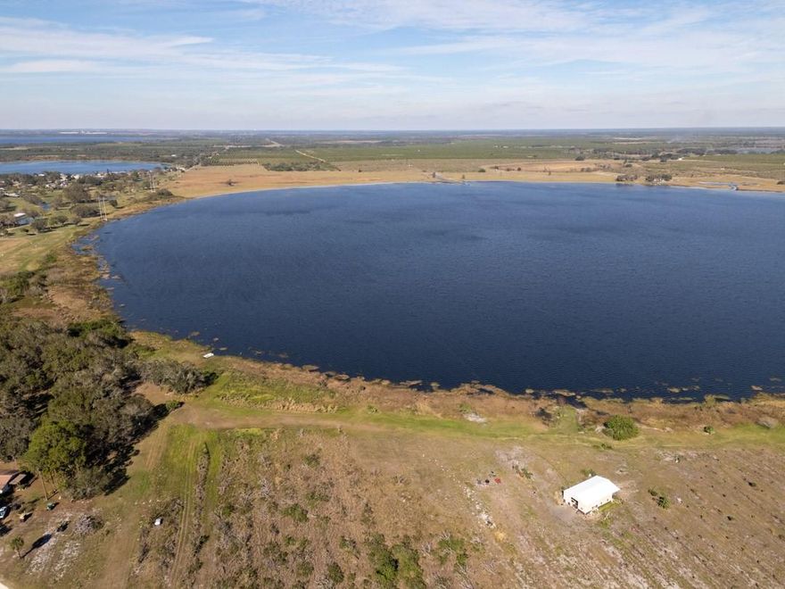 This exceptional waterfront residential land presents a rare opportunity to own a prime parcel with over 8,000 feet of frontage on Lake Pythias, more than 75% of the lake’s shoreline. Spanning across the border of Polk and Highlands counties, this property is zoned for residential development with approval for 1,100 units. Central water is available. Centrally located north of Avon Park, the property is just minutes from local shopping, schools, and essential services, including adjacent to the River Greens Golf Course. With easy access to major highways, it's only an hour to Disney and 1.5 hours to Tampa, Orlando, and Vero Beach. The county is highly supportive of growth and development in the area, with no impact fees, making this an even more attractive prospect for developers.