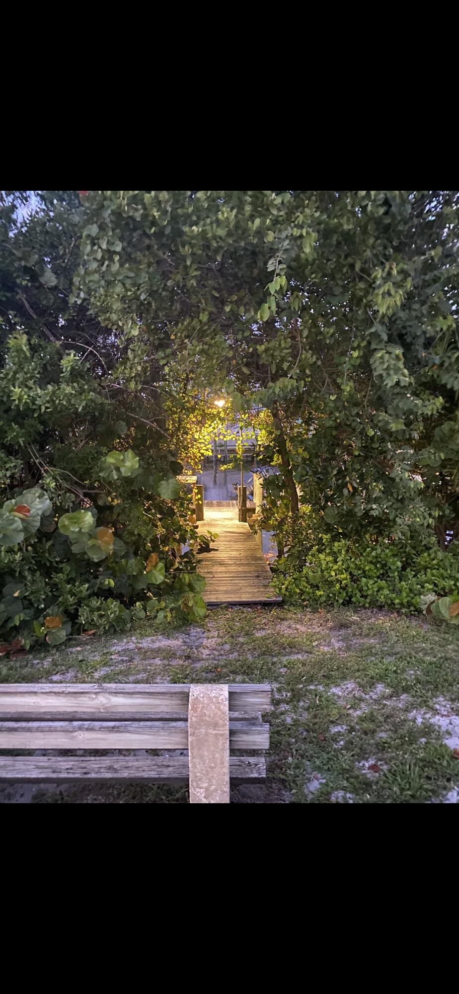 SPACIOUS TWO BEDROOM ONE BATH FIRST FLOOR property in HIGHLY DESIRED NORTH PALM BEACH with TILE FLOORING throughout. WELL MAINTAINED with beautifully DESIGNED LANDSCAPING to enjoy with lighting in the evening. Steps to the pool and canal with dock.EARMAN RIVER...across the water is Anchorage Park and Marina. GREAT LOCATION...close to restaurants, shopping and beaches...PEACEFUL HIDDEN GEM...