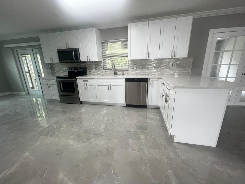 Photo of 4585 Betelnut Street, Boca Raton, FL 33428 (MLS # R11068979)