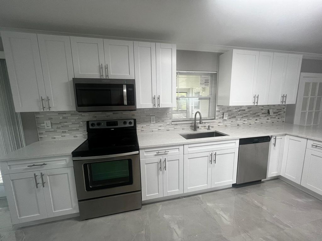 Photo of 4585 Betelnut Street, Boca Raton, FL 33428 (MLS # R11068979)