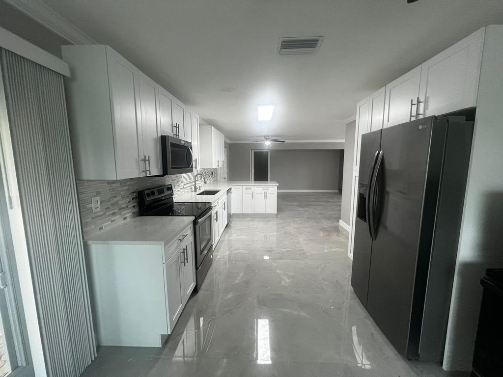 Photo of 4585 Betelnut Street, Boca Raton, FL 33428 (MLS # R11068979)