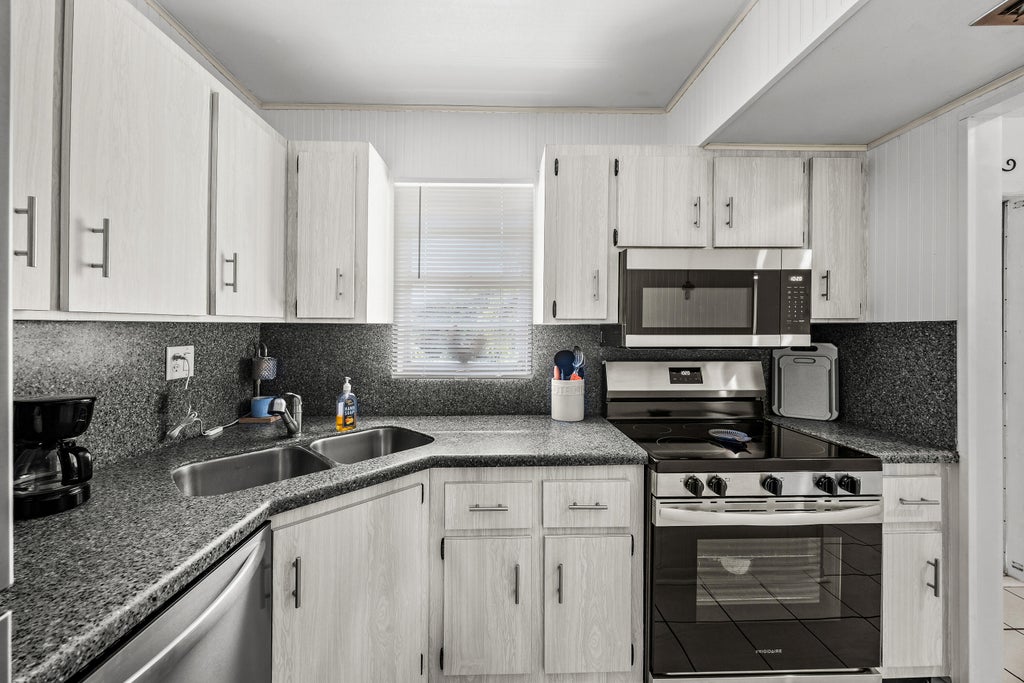 Photo of 1917 SW Palm City Road, Stuart, FL 34994 (MLS # B26075519)