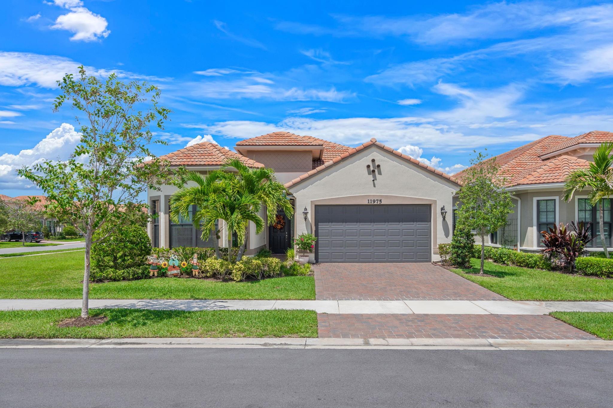 Experience refined living in this exquisitely updated 3BR, 2.5BA home in Four Seasons, one of Parkland's highly sought-after communities. Featuring a 2-car garage with a tandem space ideal for a third vehicle, golf cart, or easily converted into a 4th bedroom or office. The chef’s kitchen offers abundant cabinetry, premium finishes, and a striking custom backsplash, while motorized shades, custom walk-in closets, designer lighting, and a sophisticated built-in library elevate every space. Enjoy a fully insulated garage with A/C, retractable lanai screens for seamless indoor-outdoor living, and a whole-house water filtration system with a dedicated kitchen faucet. Four Seasons offers luxury living with a resort-style clubhouse, pool, tennis courts, and pickleball.