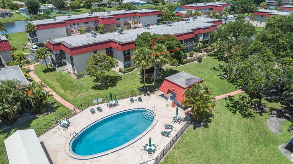 Fantastic 2 bedroom 2 bathroom condo in Greenway Village South. Super location with great view of one of the 5 pools and quiet greenspace. This unit has been upgraded for your safety and security with impact windows and doors. Both full baths have been updated. New roof in 2025 and assessment was paid by seller. Property is being sold furnished and turnkey for your full time or seasonal enjoyment. Small dogs and cats are allowed. Walk to parks, shopping and bus lines.