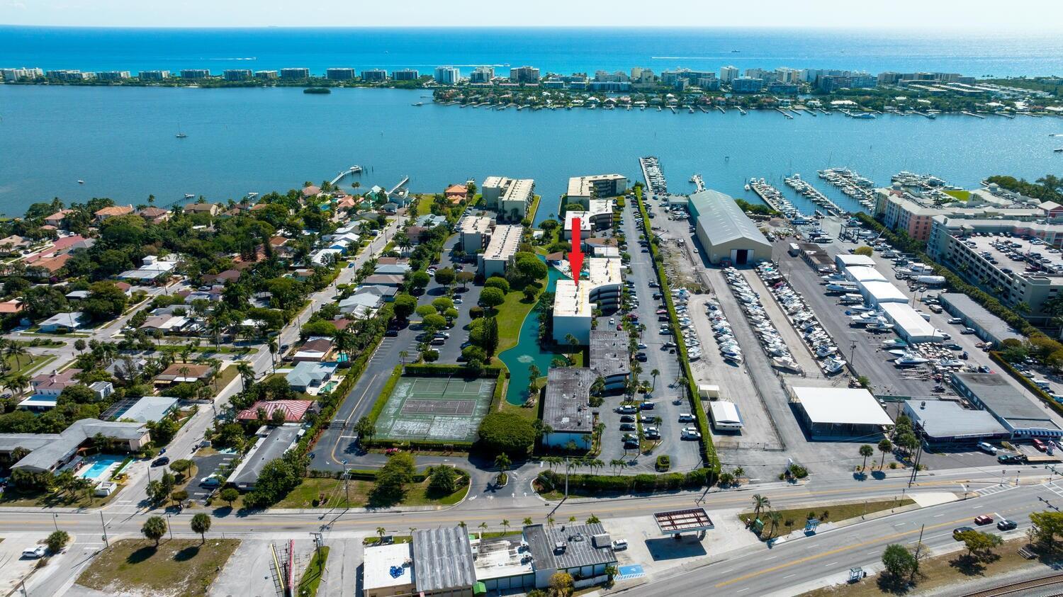 Welcome to elevated coastal living in this stunning top-floor condo, where panoramic views of the canal and the charming South Palm Park neighborhood create a serene backdrop to your daily life. Relax on the spacious, screened-in north-facing patio--perfect for morning coffee or sunset unwinding. Step inside to find a tastefully updated interior featuring crown molding, upgraded baseboards, and newer vinyl plank flooring in both bedrooms. The modern kitchen and bathrooms blend comfort with style, making this home as functional as it is beautiful. Located in a highly sought-after Intracoastal community, enjoy resort-style amenities including a sparkling pool, clubhouse with an exercise room, game room, library, and sauna. With basic cable and water included in the rent, convenience is key.