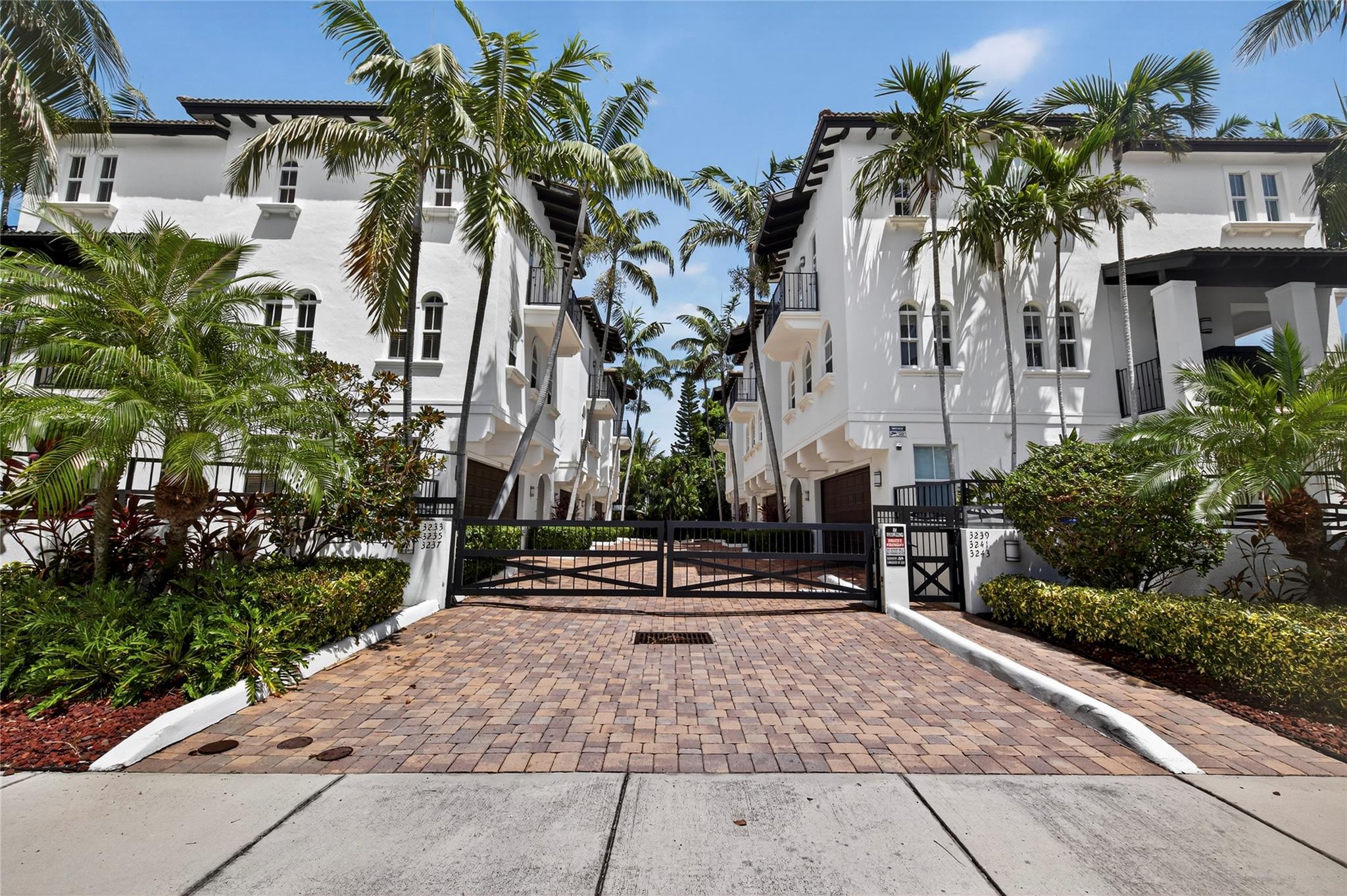 Discover modern living in this gated townhouse offering luxury, privacy, and convenience. The ground floor includes a bedroom, full bath, 2 car garage, elevator for ease, a covered porch overlooking the fenced lap pool framed by palm trees. While the 2nd floor features spacious living areas w/ gorgeous garden view, granite & stainless-steel kitchen w/ lots of storage space, 1/2 bath, laundry room w/ utility sink. On the 3rd floor, the master suite boasts a private balcony w/ garden view, ensuite bath w/ separate tub & shower, bidet, his and hers closets, along w/ 2 additional bedrooms w/ balconies. Located 1 block from the beach, Pier, public boat ramp. Minutes from Atlantic Blvd dining, shopping centers, Harrah's casino, 6 min to 95, 12 min to Broward health & 20 min Ft Lauderdale Airport