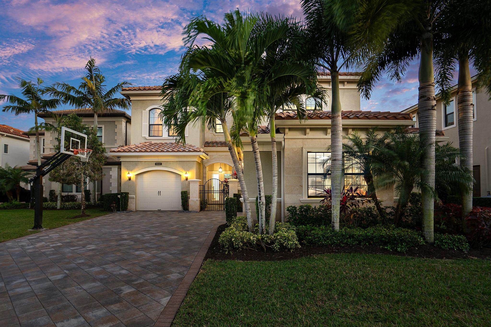 Situated on a premium lake lot, this beautiful 5-bedroom, 7.5-bathroom estate home in Seven Bridges a luxury lifestyle. Upon entry you are greeted with Premium engineered wood floors which runs throughout the main & upstairs living area. The two-story living room has 24ft high ceiling with a wet bar, perfect for entertaining. The chef's kitchen boasts stacked cabinets, Subzero, wolf stainless steel appliances a gas cooktop. The 2nd floor primary suite includes a sitting area, his & her baths & two custom closets along with 3 en-suite bedrooms & a loft. The resort-style backyard features an outdoor kitchen, heated saltwater pool & spa with panoramic water views. Impact windows, & a 3-car garage complete this masterpiece in a world-class community. Take the opportunity to see this Gem.