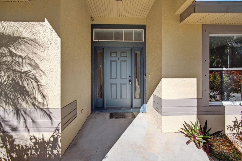 Photo of 1941 SW Oakwood Road, Port Saint Lucie, FL 34953 (MLS # F10545056)