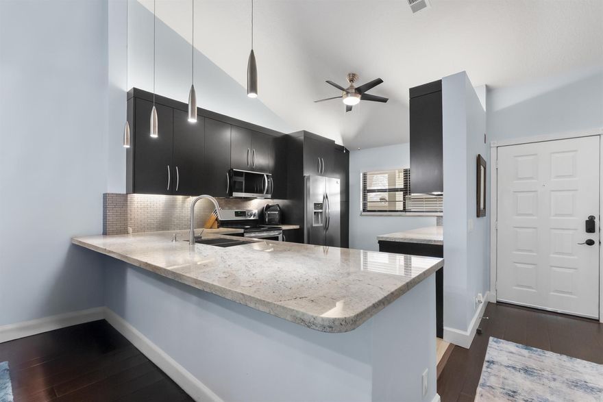 Welcome To Your Fully Renovated Retreat In The Sought-After Gated Golf Community Of Eastpointe In Palm Beach Gardens! This 2-Bedroom, 2-Bathroom Condo Offers 1,300 Sq. Ft. Of Light-Filled Living Space With Vaulted Ceilings And A Stunning Lake View. Every Detail Has Been Updated -- From The Roof To The Floors. Enjoy A Brand-New Kitchen And Bathrooms, New A/C And Air Ducts, Recessed Lighting, Modern Fixtures, Fresh Paint, New Water Heater, And Top-Rated Impact Windows. Relax On Your Private Balcony Overlooking The Serene Lake. Eastpointe Features Two Newly Designed 18-Hole Golf Courses, Lush Landscaping, And No Upcoming Assessments. Move Right In And Enjoy!