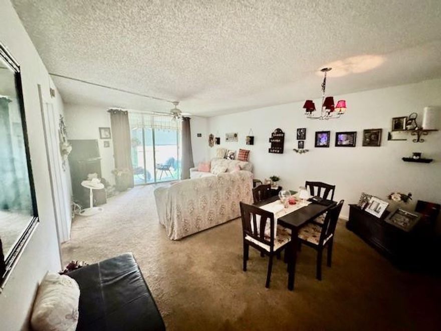 Spacious 2BR/2BA lakefront condo in desirable Palm Springs #2. This bright unit features a functional living and dining layout, entry-level bedroom access, and a screened balcony overlooking peaceful lake views. Interior highlights include tile and carpet flooring, central A/C, and in-unit washer and dryer. Enjoy a well-maintained community with amenities including a clubhouse, fitness center, pool, library, shuffleboard, extra storage, and vehicle wash area. Maintenance covers cable, internet, water, roof repairs, pest control, landscaping, and more. Conveniently located near shopping, dining, and major roadways—ideal for seasonal or year-round living.