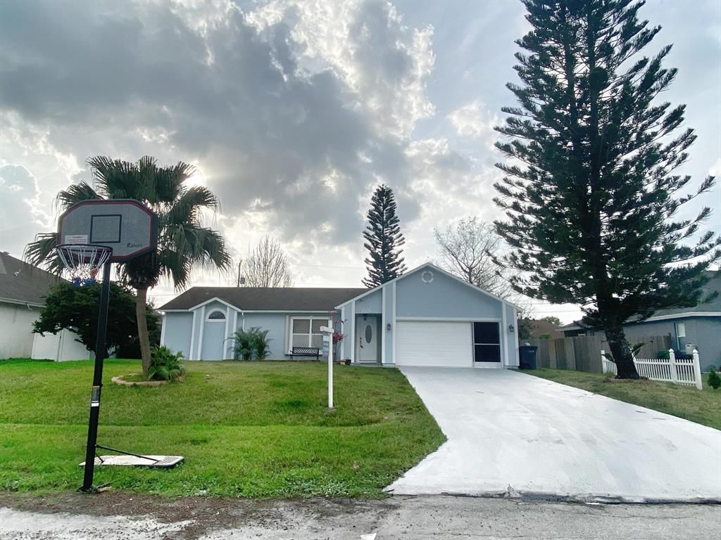 Photo of 3826 SW Kocerik Street, Port Saint Lucie, FL 34953 (MLS # R10697209)