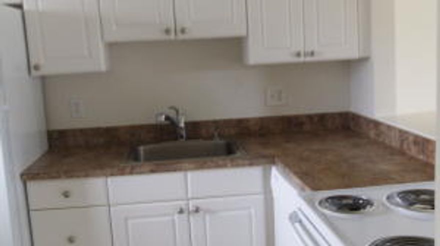 Not age restricted building in East Boca! Updated 2 bedrooms 2 baths  corner apt with lots of light and screened patio! All tile floors, new air-conditioning system, new appliances, newly painted and shows well. Community pools and near Boca beaches and FAU. There is a special assessment of approx. $114 per month which will end Oct. 2022.