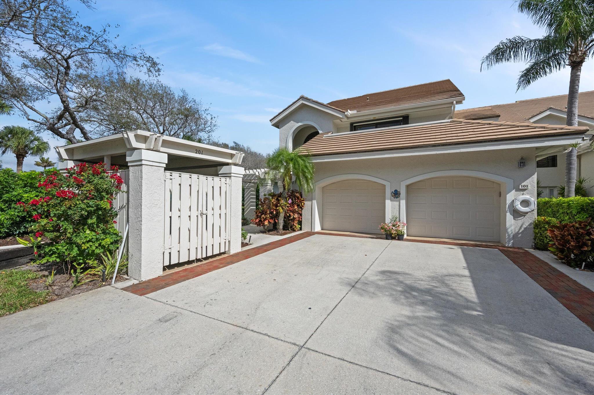 Welcome to 3971 Schooner Pointe Drive #201, an exceptional 3-bedroom, 2-bath corner-unit condo located in the sought-after West Bay at Jonathan's Landing in Jupiter, Florida. Offering 1,839 sq ft of beautifully maintained living space, this light-filled residence delivers the perfect blend of comfort, privacy, and scenic lakefront views--all within a prestigious gated community with 24/7 manned security.Situated on the second floor, this spacious condo features soaring vaulted ceilings. The generous living and dining areas open to a screened balcony and patio, where you can enjoy peaceful lake breezes and vibrant sunsets from your s