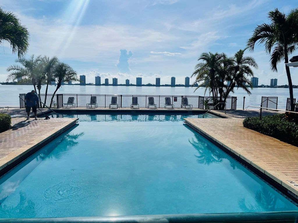 Photo of 1050 Lake Shore Drive #102, Lake Park, FL 33403 (MLS # R10921383)