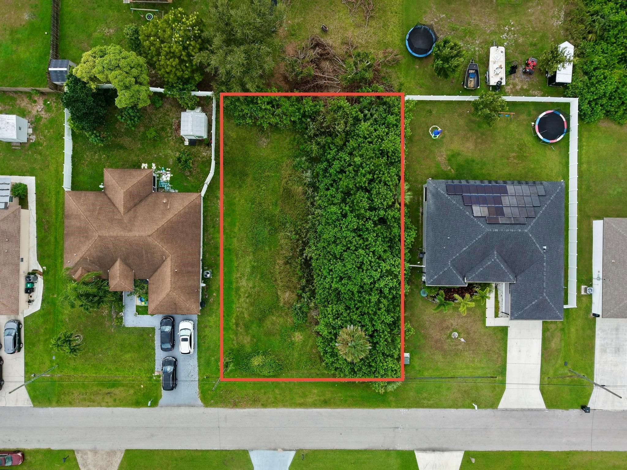 Build Your Dream Home Near Tradition - Prime Location!Discover the perfect canvas for your future home on this partially cleared lot located in a well-established and desirable neighborhood. Enjoy the convenience of being just minutes from Tradition, where you'll find an abundance of shopping, restaurants, hospitals, and entertainment options to suit every lifestyle.Families will appreciate the close proximity to schools, parks, and the public library. For commuters, quick and easy access to community transport, 95, Florida Turnpike via Becker Road ensures smooth travel throughout the region. Located within 45 mins of Palm Beach International Airport. Don't miss this opportunity to create the home you've always wanted in a thriving, connected neighborhood!