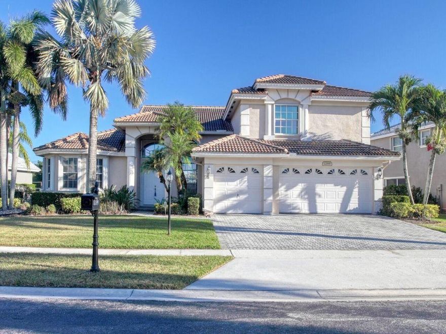 You'll love this beautifully updated home from the moment you enter. Vaulted ceilings, plenty of recessed lighting, porcelain tile floors throughout the public rooms and luxurious laminate in all of the bedrooms. The gourmet kitchen has the best of everything - granite counters, 42'' cabinets, stainless steel appliances, plenty of storage and an eat-in area. All of this overlooks the spacious family room with French doors leading to the screened, covered patio. Beyond is the extended, heated  pool with waterfall, large outdoor patio and backyard - all of which overlook the tranquil lake. The 1st floor master bedroom has 2 closets,  a roomy bathroom with dual sinks, separate shower and roman tub. Upstairs there  are 3 bedrooms & 2 full bathrooms. All of this located in gated Boca Falls which boosts a beautiful clubhouse with fitness center, pool, basketball and tennis courts and more....And, you're just minutes from the South County Regional Park!