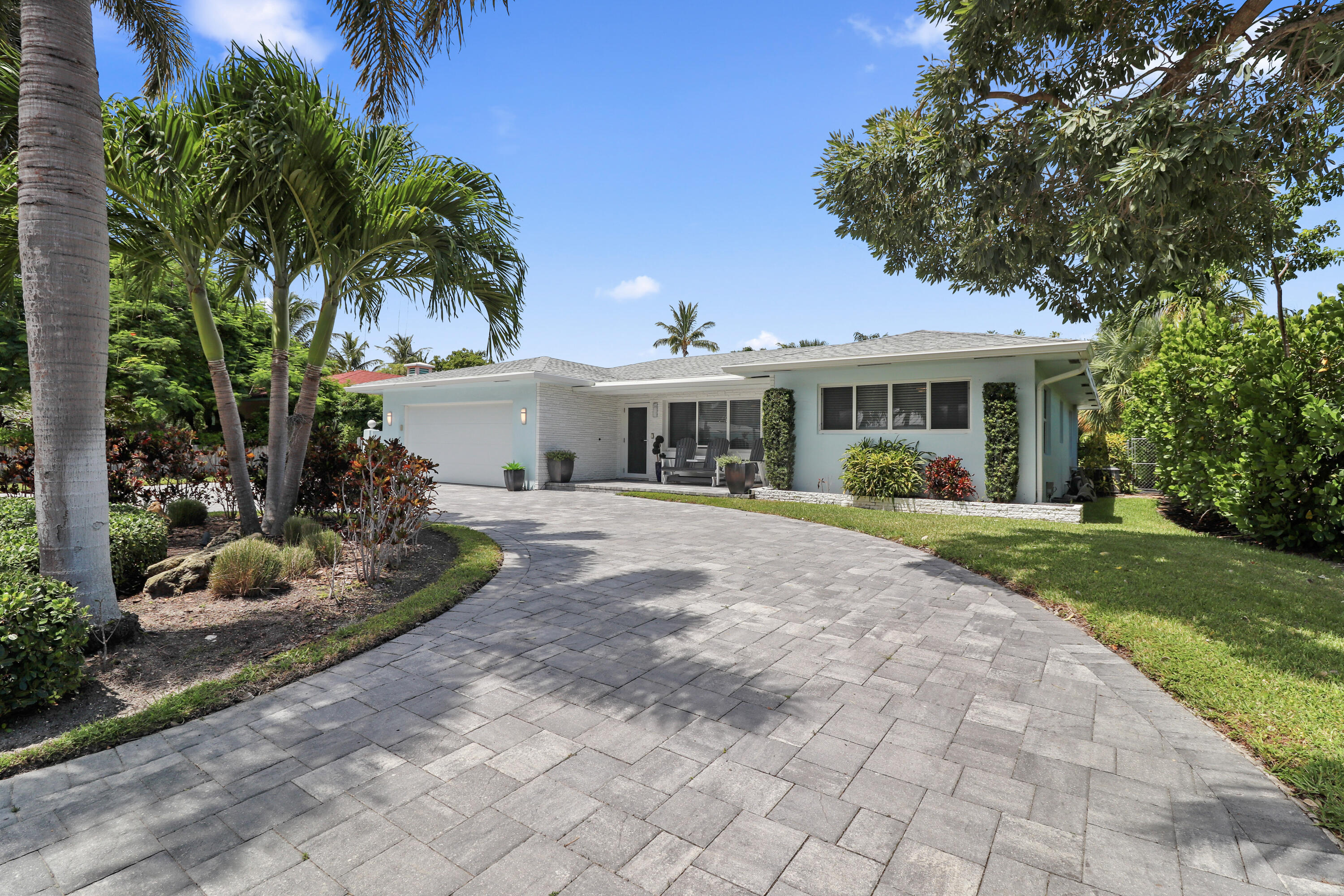 Welcome to your seaside retreat. Beautifully renovated 3BR 2BA 2 car garage pool home in highly sought-after Palm Beach Shores, FL. Renovations were completed in late 2020. Includes new impact windows throughout, new roof, new circular paver driveway, epoxy coated garage floor, new A/C, all new Samsung Smart appliances which include ''steam ''oven and induction cooktop, quartzite kitchen countertops, luxurious Cristallo quartzite kitchen island w/custom lighting and wine cooler, in-ceiling sound system, high hat lighting throughout all main living areas, ''liquid nickel'' ceiling fans, guest bathroom w/double sinks, master bedroom suite with French doors leading to private fenced backyard, outdoor shower.