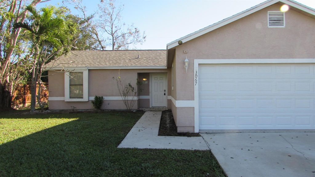 Photo of 3067 SW Circle Street, Port Saint Lucie, FL 34953 (MLS # R11046044)