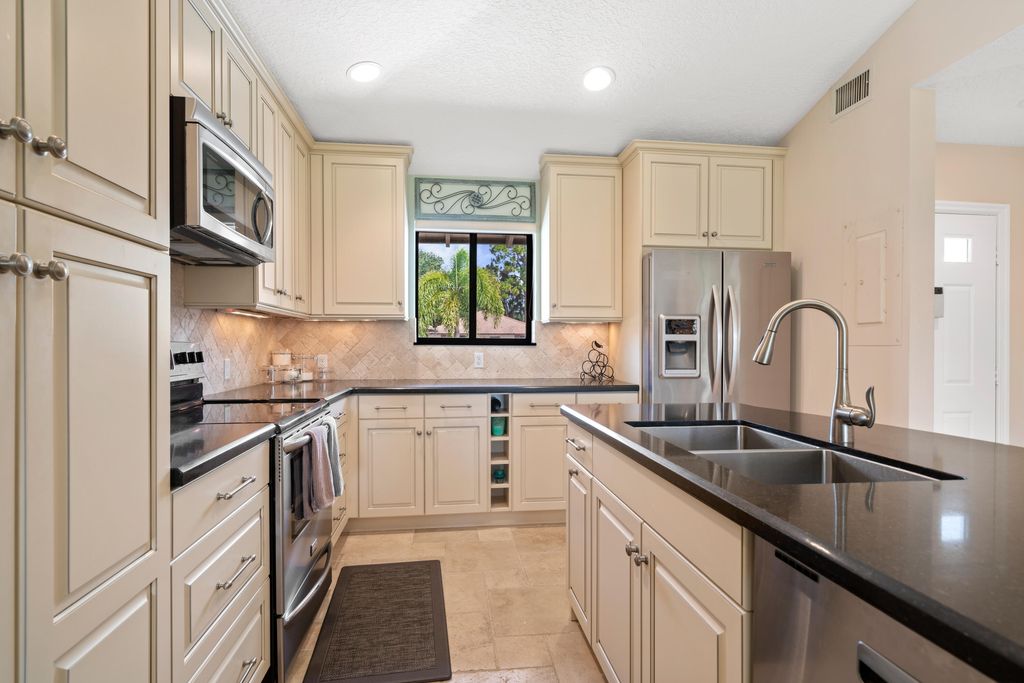 Photo of 711 Club Drive, Palm Beach Gardens, FL 33418 (MLS # R11118155)