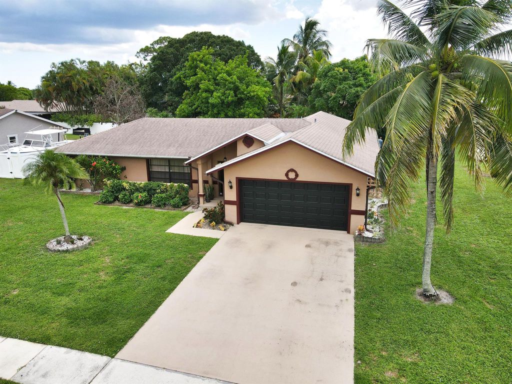 Photo of 145 Santa Monica Avenue, Royal Palm Beach, FL 33411 (MLS # R11117770)