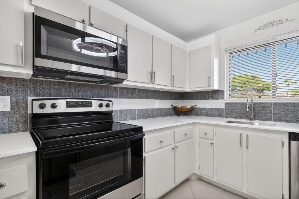 Photo of 7770 Tahiti Lane #102, Lake Worth, FL 33467 (MLS # B26090878)