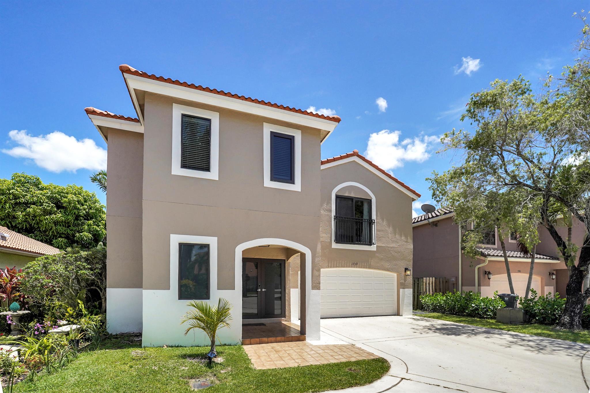 This beautifully updated single-family home boasts a NEW ROOF (2022), IMPACT WINDOWS & DOORS (2023), and fresh exterior paint (2024). Step inside to new flooring, vaulted ceilings, an updated kitchen with stainless steel appliances, and a screened patio perfect for relaxing. The home features the largest backyard of its model, with a brand new irrigation system (2024), lush new grass, and privacy-enhancing Clusia hedges along a new fence. Only a stone's throw away from the community pool. Don't miss out on this rare opportunity offering style, comfort, and outdoor space, near all equestrian facilities.