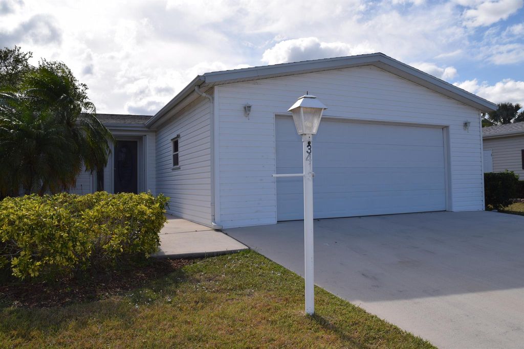 Photo of 3413 Crabapple Drive, Port Saint Lucie, FL 34952 (MLS # R10980998)