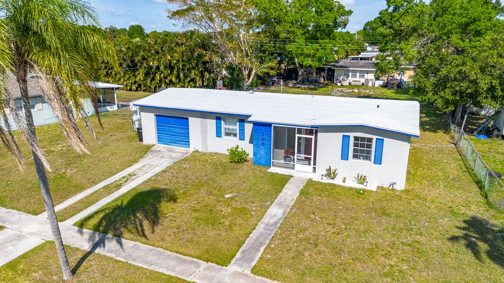 Photo of 105 SE Naranja Avenue, Port Saint Lucie, FL 34983 (MLS # R11070543)