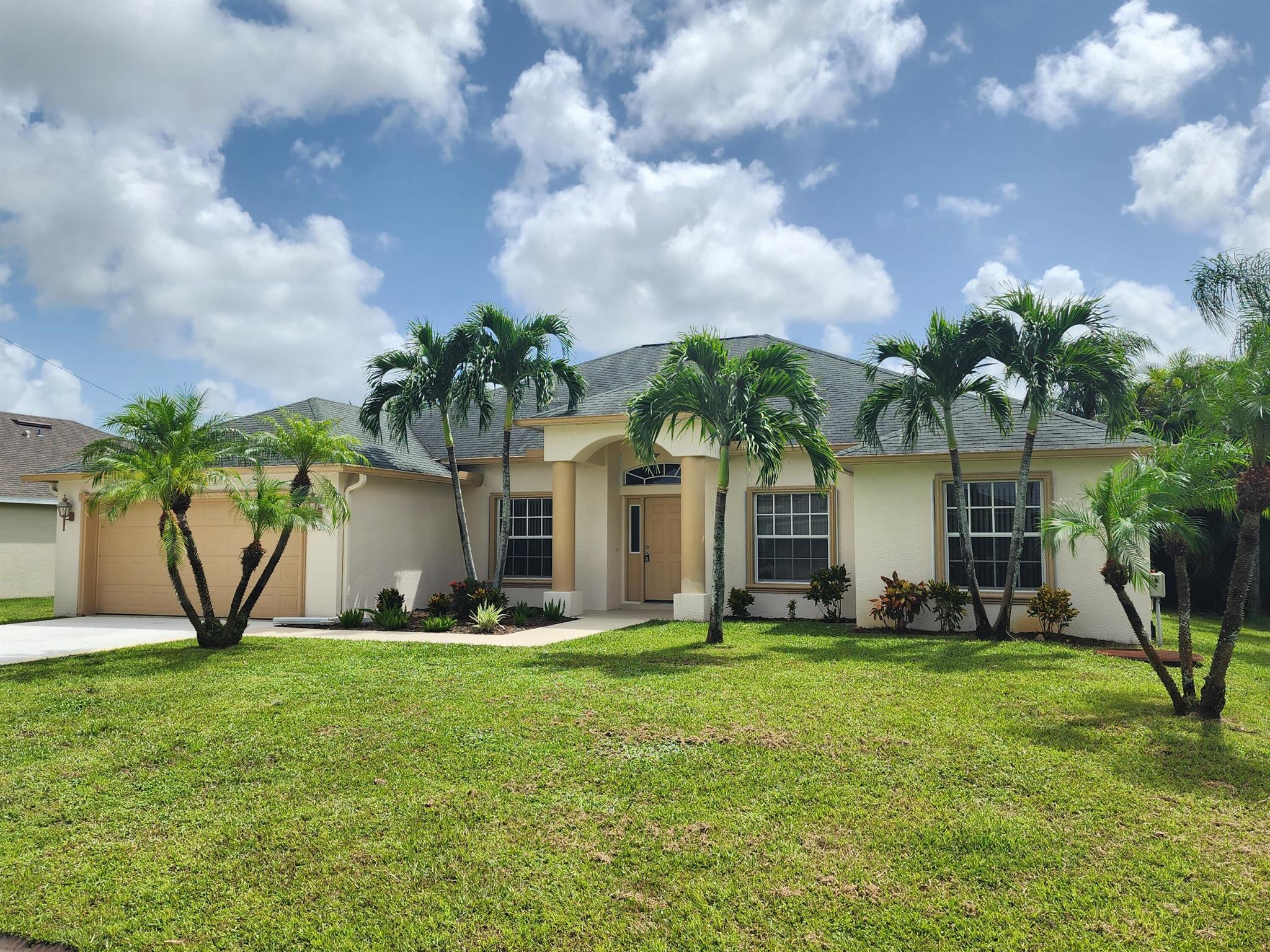 Spacious 4 BR 3 BA 2 CG rental in western PSL. Great location, located only minutes to I95 and the traditions PUD. Close to Treasure Coast High School. Tile in living areas, granite tops in kitchen, stainless appliances, formal dining, inside laundry room. Covered porch, and private backyard. First Last and Security is required. Washer and Dryer included but not warranted.