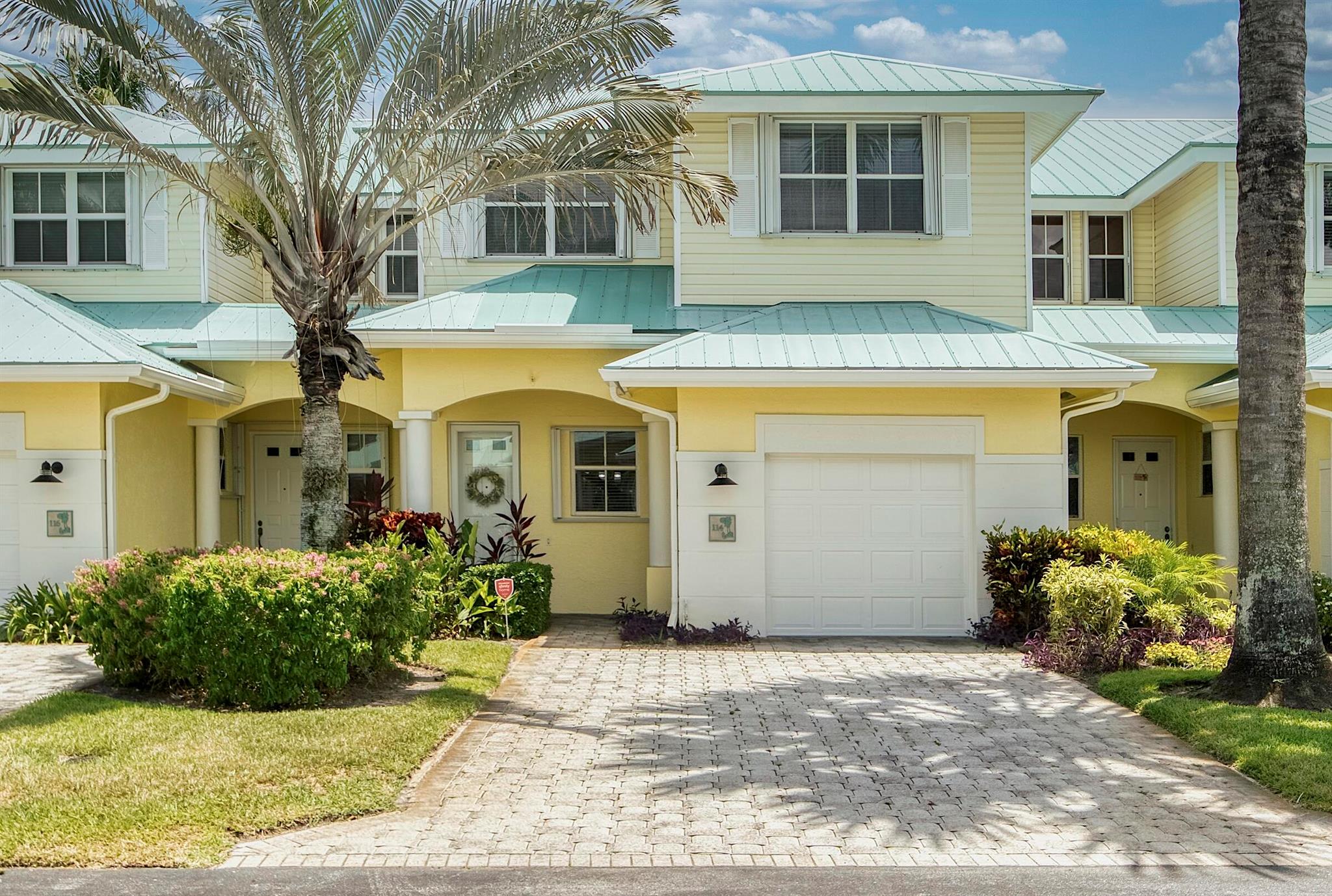 SPECIAL INCENTIVE: Owner will contribute 50% of the HOA fee for the first two years- an exceptional opportunity in one of the area's most desirable neighborhoods.Discover coastal living at its finest in this pristine, fully remodeled Key West style townhouse, perfectly situated in a highly sought-after intracoastal community. Bright, airy interiors blend modern upgrades with timeless charm, offering move-in-ready elegance. Enjoy resort-style intracoastal pool and lounging area for a relaxed waterfront lifestyle, all within minutes of shopping, fine dining and beaches. Lush backyard landscaping and expandable awning lends perfectly for enhanced living and entertaining. The one car garage and double driveway provides ample parking. Perfect both inside and out.