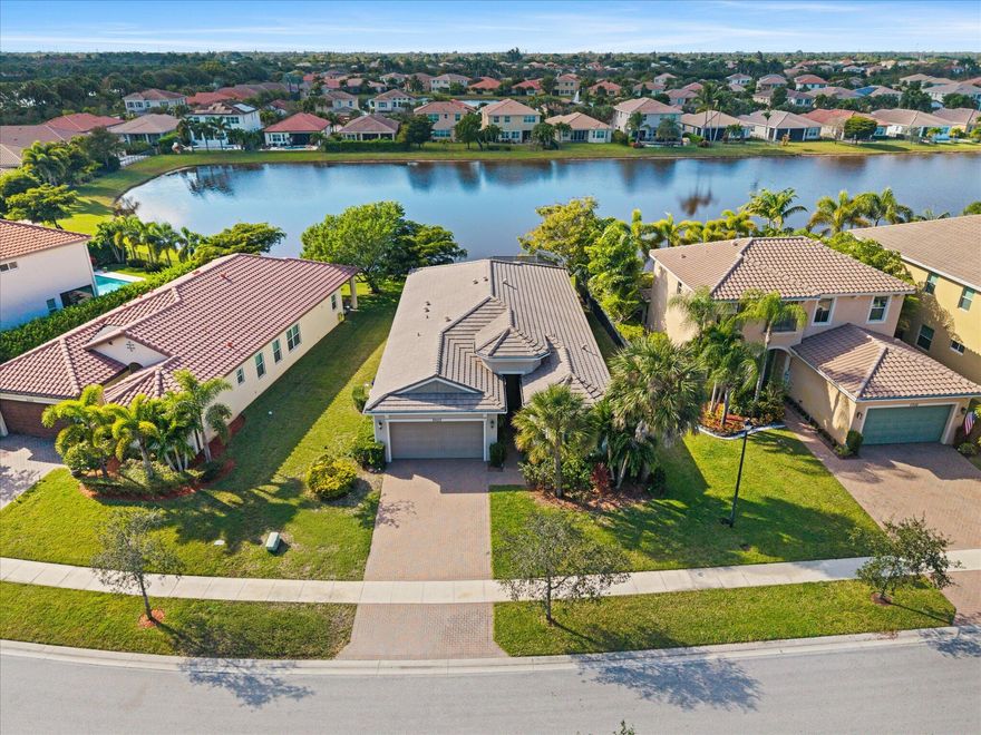 SPECTACULAR LAKEFRONT LIVING |  LOW HOA | Complete Hurricane Impact Windows & Doors | Spacious Split-Bedroom Floor Plan w/ Additional Den | Vaulted Ceilings & Recessed Lighting | Eat-In Kitchen | Granite Counters, Wood Cabinetry, Stainless Appliances & Island w/ Barstool Seating | Primary Suite w/ Lake Views | Two Walk-In Closets | En-Suite Bath w/ Dual-Sink Vanity & Oversized Walk-In Shower | 2nd Bath w/ Shower/Tub Combo | Extended Screened Patio | Gorgeous Sunsets & Backyard Bass Fishing | Resort-Style Amenities | Tennis, Basketball & Volleyball Courts | Heated Community Pool & Jacuzzi | Splash Park & Playground | Full Fitness Center w/ Children's Playroom | Minutes To Downtown West Palm & World-Renowned Wellington Equestrian Center | ROOF 2015 | AC 2015 | WH 2015