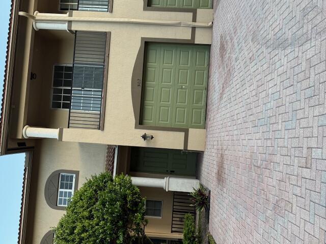 Townhome with spacious floor plan, granite countertops in the kitchen, tile and laminate throughout.