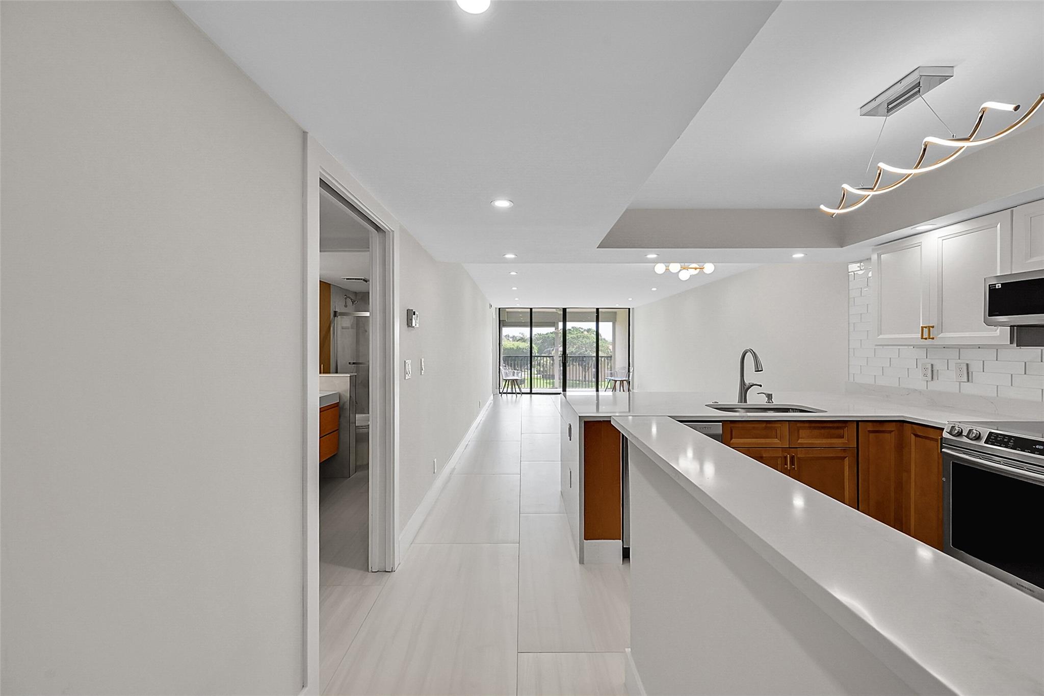 Completely re-modeled throughout! Enjoy breathtaking WATERFRONT views from the comfort your balcony. 40 years passed; Budget is great! This 55+ 2/2 condo features: a spacious eat in kitchen , WASHER/DRYER in the unit, and additional storage unit. Centrally located near Seminole Casino, hospital, and restaurants and close to the Trnpk & Sawgrass Exp. The building features an elevator while some of the community amenities include billiards, 3 heated pools, shuffleboard, walk/jogging path, tennis, pickleball & basketball courts w/ a clubhouse filled w/ activities you'll never be bored. The low maintenance fee includes cable TV, water, trash, exterior insurance, & common ground maintenance!