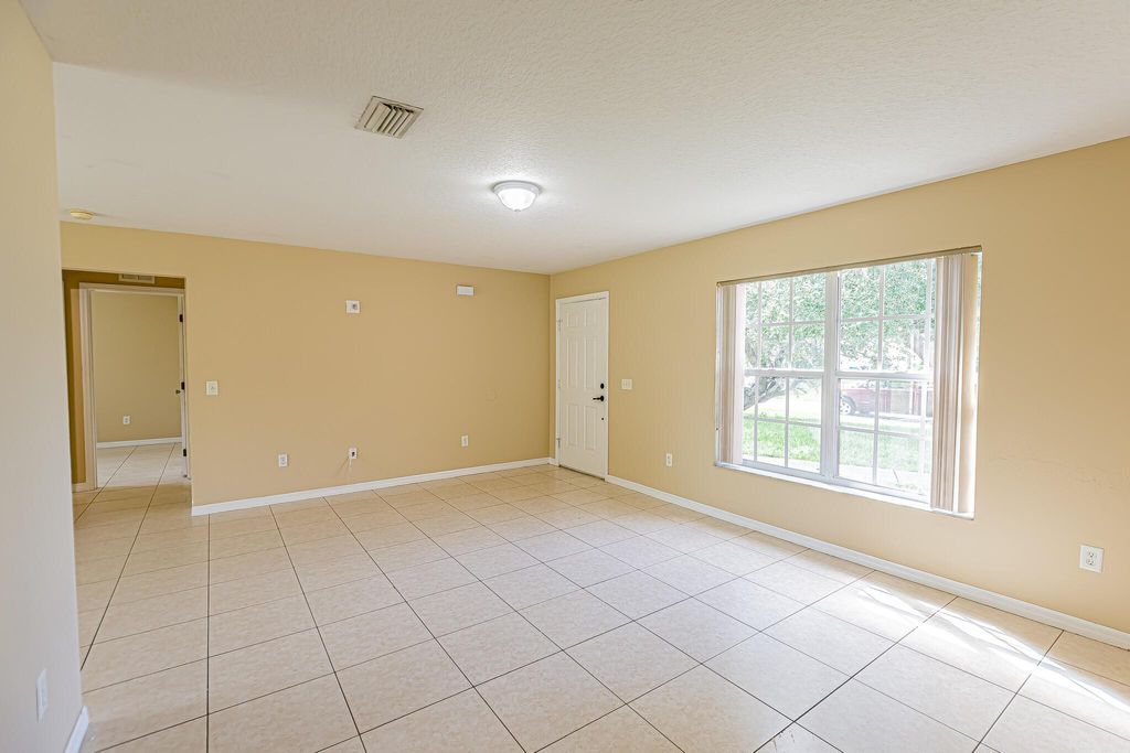 Photo of 719 SE Atlantus Avenue, Port Saint Lucie, FL 34983 (MLS # R11005122)