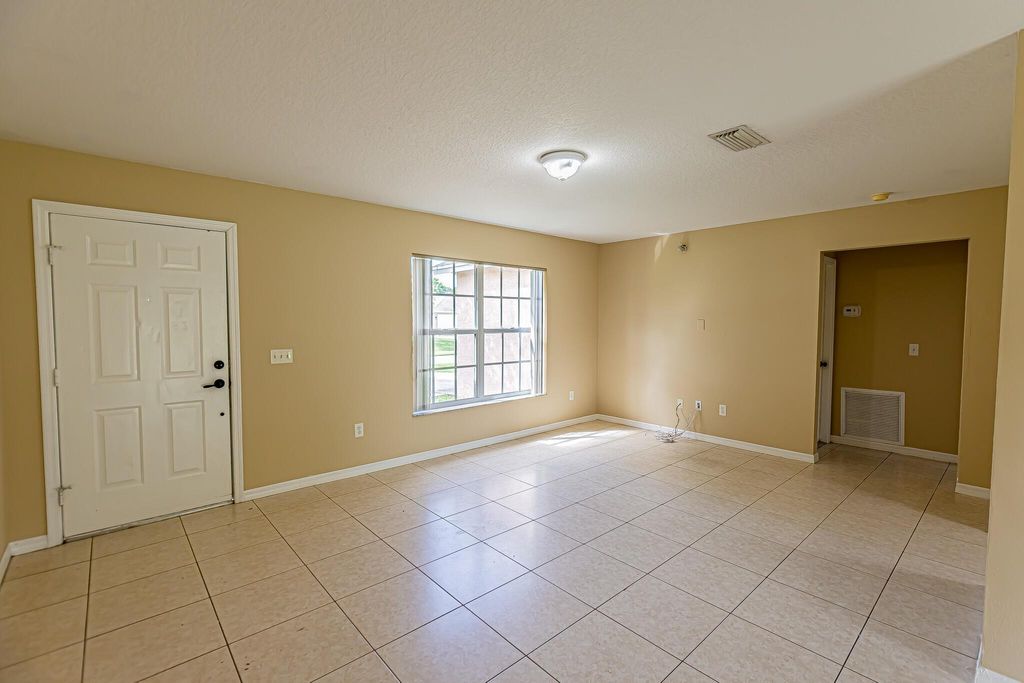 Photo of 719 SE Atlantus Avenue, Port Saint Lucie, FL 34983 (MLS # R11005122)