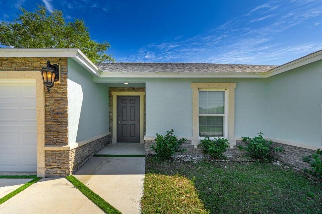 Photo of 2372 SE Maslan Avenue, Port Saint Lucie, FL 34952 (MLS # B26016847)