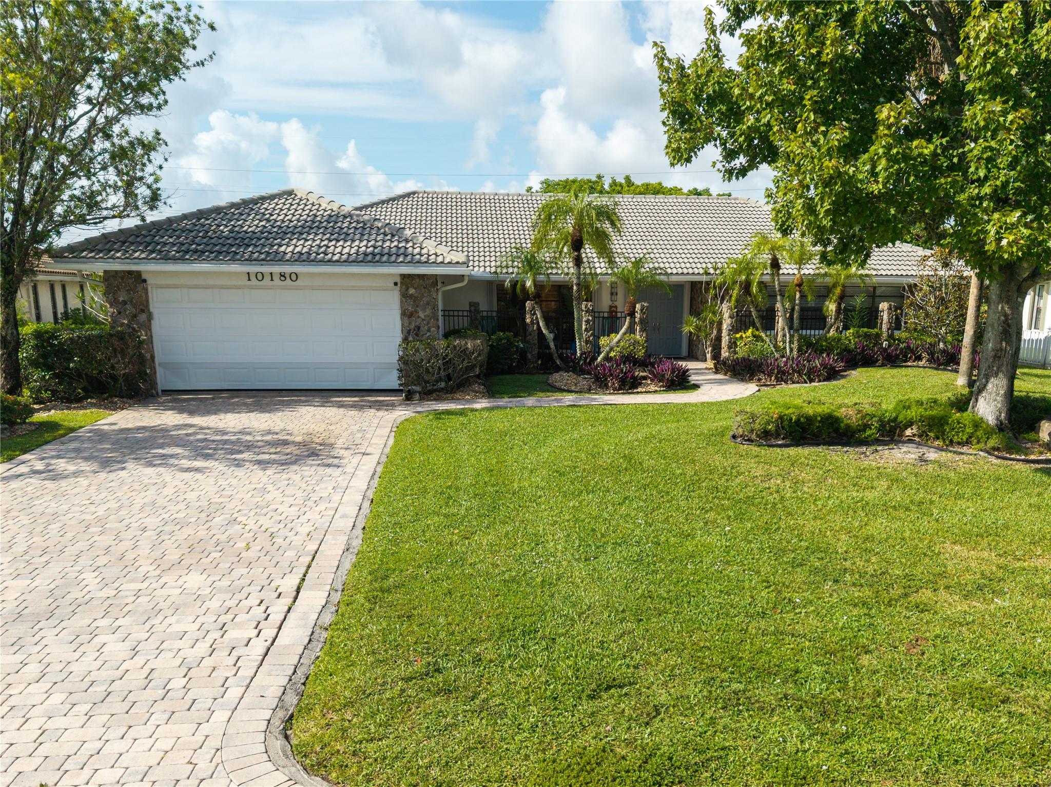 LOCATION! LOCATION! Prestige Waterfront Home in the Heart of Coral Springs features 4 Bedrooms, 2.5 Bathrooms, 2 Car Garage with Pool & your own Private Dock! Stunning Kitchen has top-of-the-line appliances with wood cabinets & plenty of storage space. Spacious Bedrooms with walk-in closets. Enjoy your Tropical Backyard with outdoor cooking, BBQ Grill & Pool! Take advantage of your own Dock to do all the boating, jet skiing, & fishing you want! Great for entertaining family & friends during the holidays! Close to Sawgrass HWY, Coral Springs Mall, Shopping Plaza's, Restaurants & much more! Super Nice Park has Playground less than 5 mins walking distance, very fun for the kids! GOOD SCHOOLS! NO HOA! HUGE LOT! BOATERS WELCOME! LOOK NO FURTHER THIS HOME IS A MUST SEE! SEE IT! LOVE IT! BUY IT!