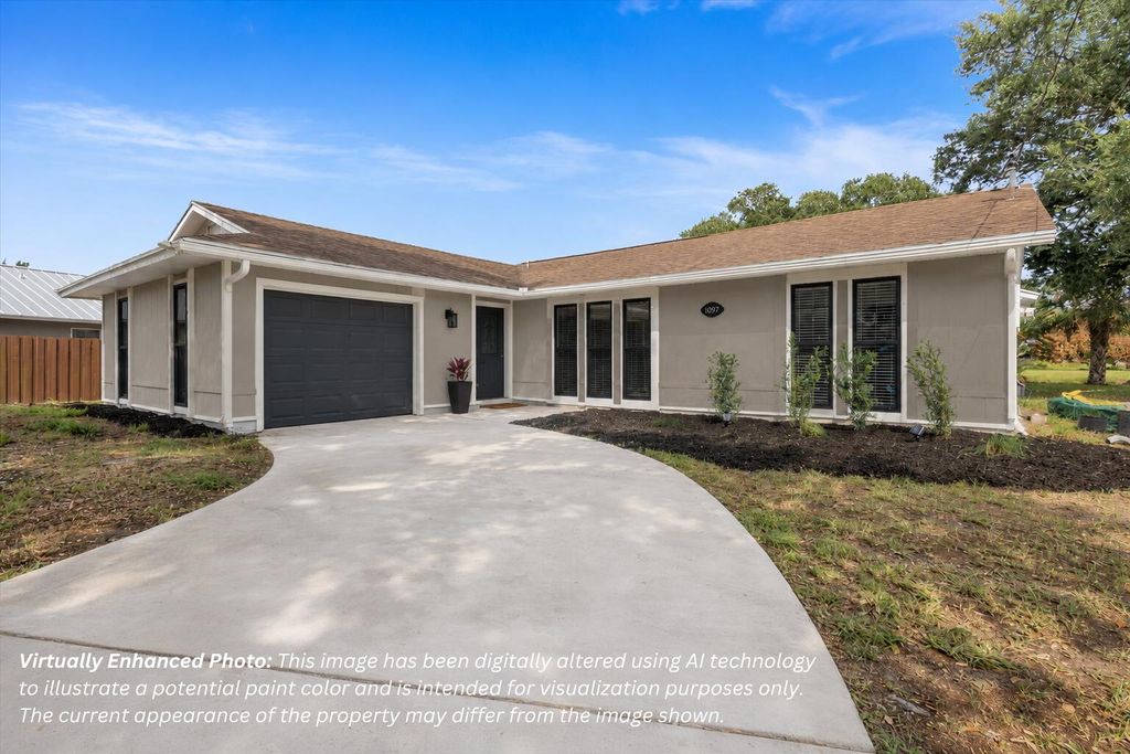 Photo of 1097 SW Mcdevitt Avenue, Port Saint Lucie, FL 34953 (MLS # B26043220)