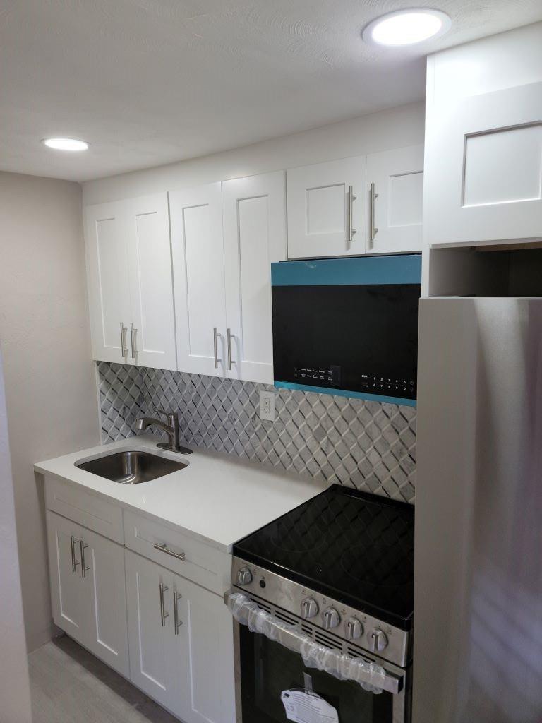 Beautiful efficiency approximately 450sq ft. Full kitchen with updated SS appliances. Home is located in a nice quiet neighborhood. Bathroom has been remodeled. Tile floors. Rent includes water and electricity. Tenant must have a clean background, no eviction, and credit score of 630 or higher. Home is ideal for one occupant (maybe two). This one will go fast !!! 1st, last and security required.