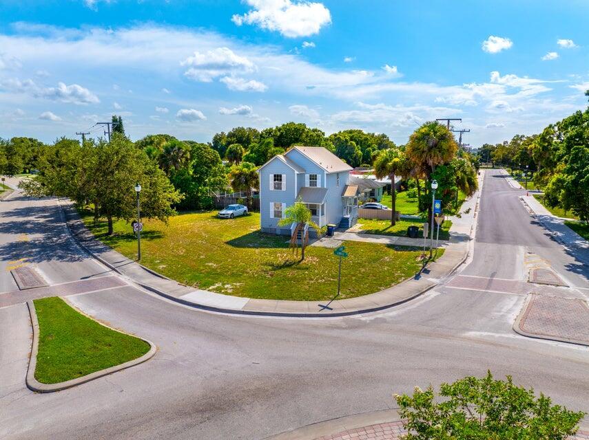 Discover this beautifully renovated two-story home, perfectly situated on a spacious corner lot in the vibrant heart of Fort Pierce. Featuring stylish and durable vinyl flooring throughout, this home offers a modern touch with easy maintenance. The newer metal roof ensures lasting durability and peace of mind. Enjoy the best of city living with beaches, shopping, dining, and major highways just minutes away. Whether you're looking for a primary residence or a fantastic investment opportunity, this home combines comfort, convenience, and location