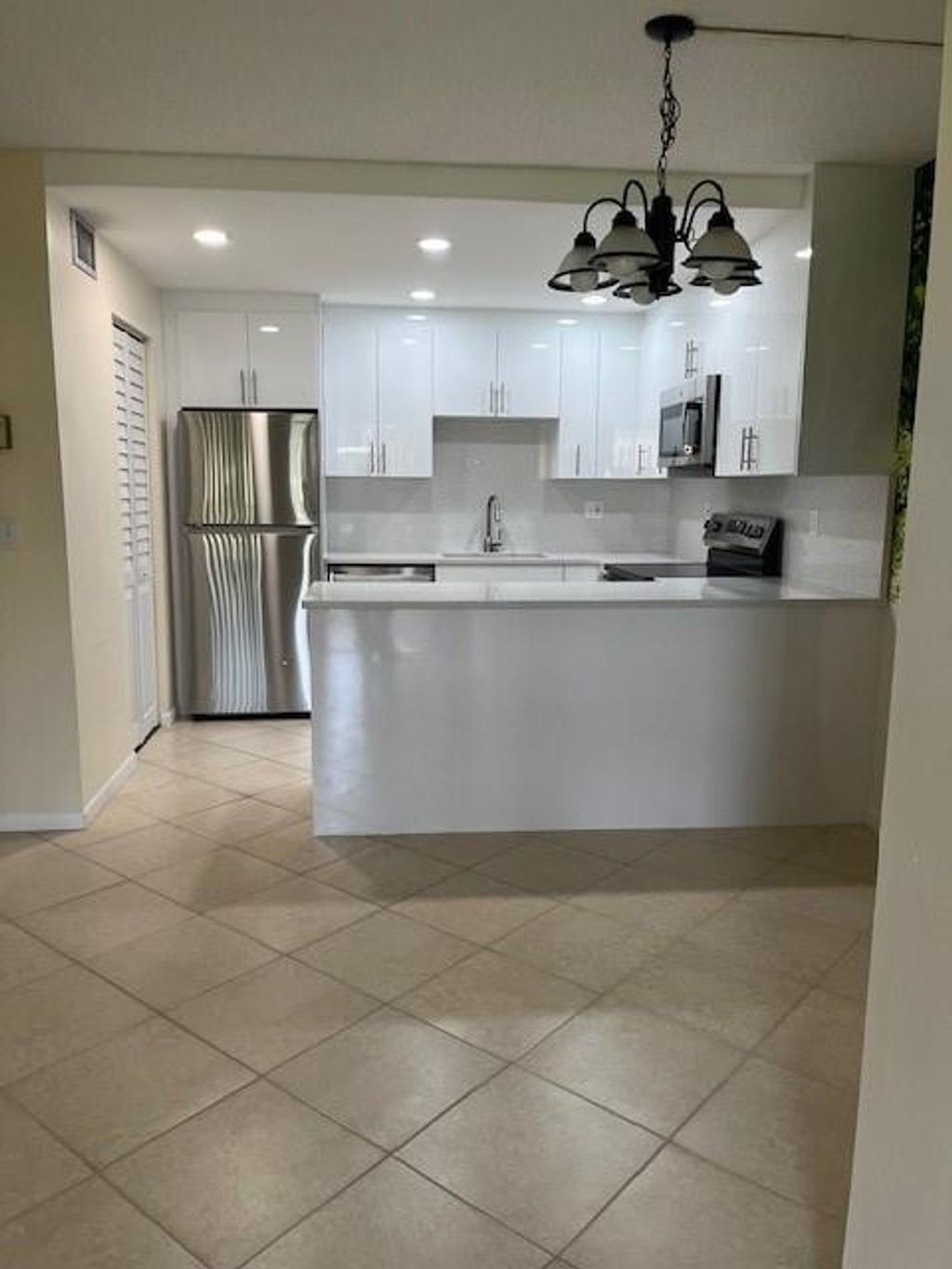 Photo of 418 Pine Glen Lane #C-1, Greenacres, FL 33463 (MLS # F10515511)