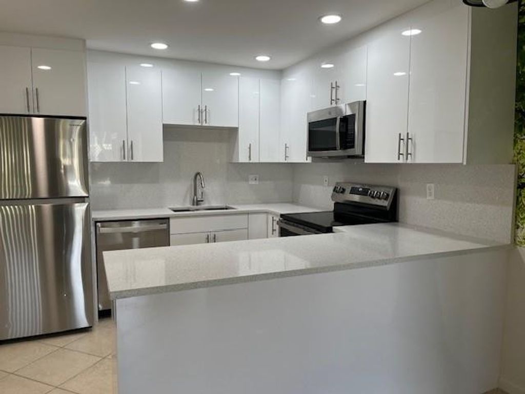 Photo of 418 Pine Glen Lane #C-1, Greenacres, FL 33463 (MLS # F10515511)