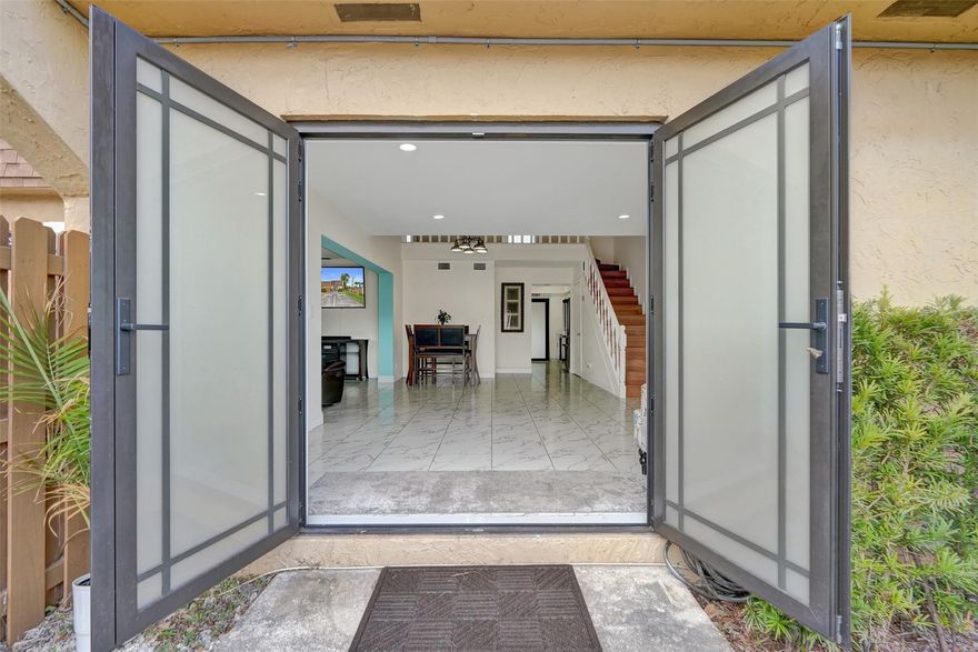 Looking for a home that feels peaceful, beautifully updated, and is move-in ready? This upgraded townhome features impact-rated windows & doors, a new roof, designer window treatments, and a bright modern kitchen with white shaker cabinets, quartz-style counters, and stainless steel appliances. Soaring ceilings and sleek tile floors create an inviting flow perfect for relaxing or entertaining. Spacious bedrooms offer quiet retreats, while calming lake views elevate your daily routine. Remodeled bathrooms with modern features continues the list of upgrades. A brand-new community pool and tennis center nearby add resort-style living to your doorstep. With the big upgrades done and the lifestyle boxes checked, this home gives you the comfort, protection, and the ease today’s buyers want.